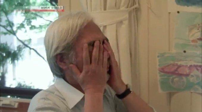 Miyazaki with Hands over Face