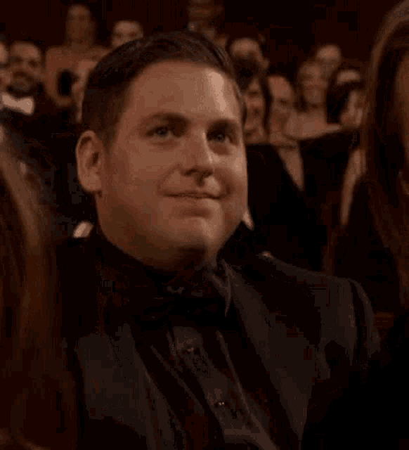 Smirking Audience Member