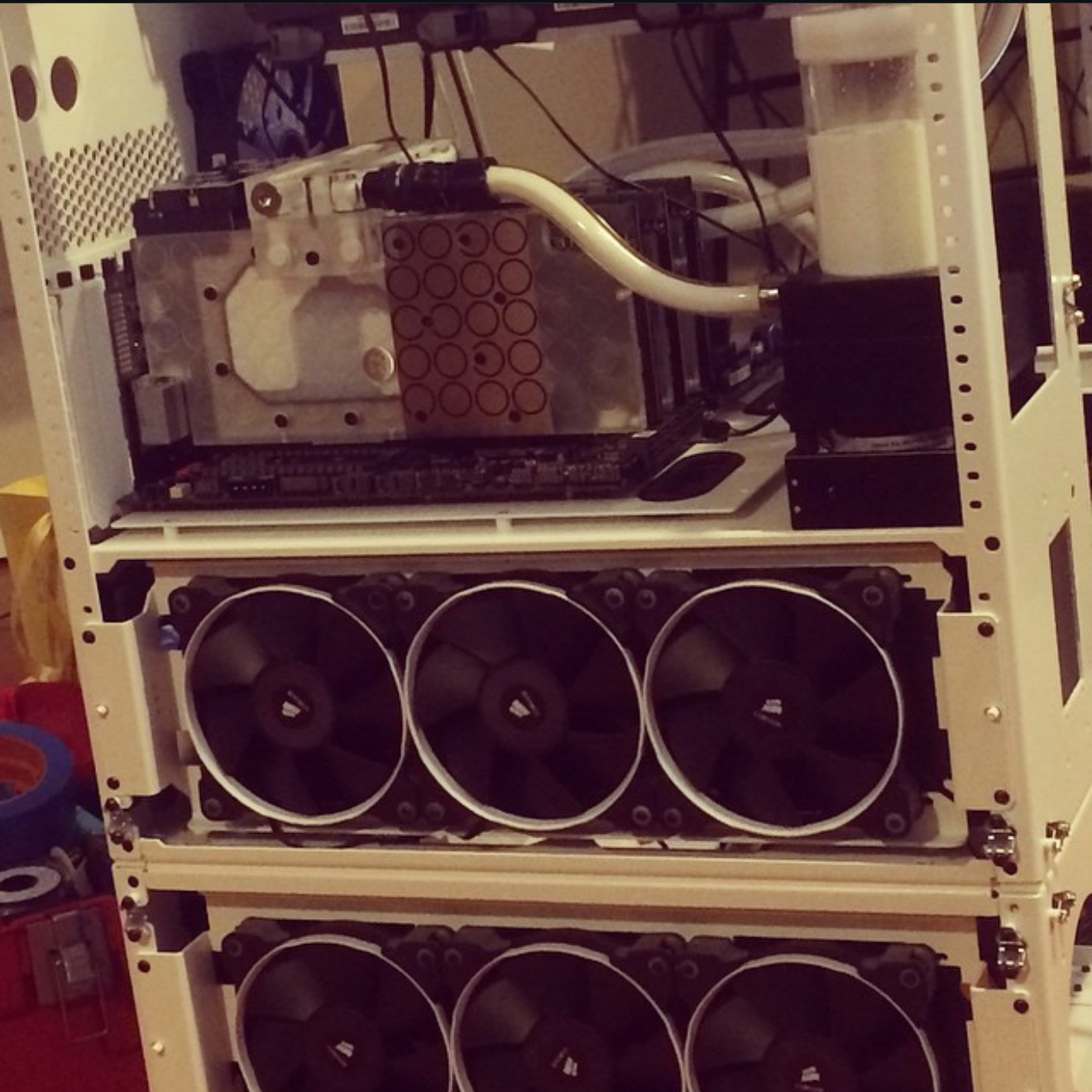 Recovered Instagram crop of a CaseLabs watercooling loop with radiators and fans.